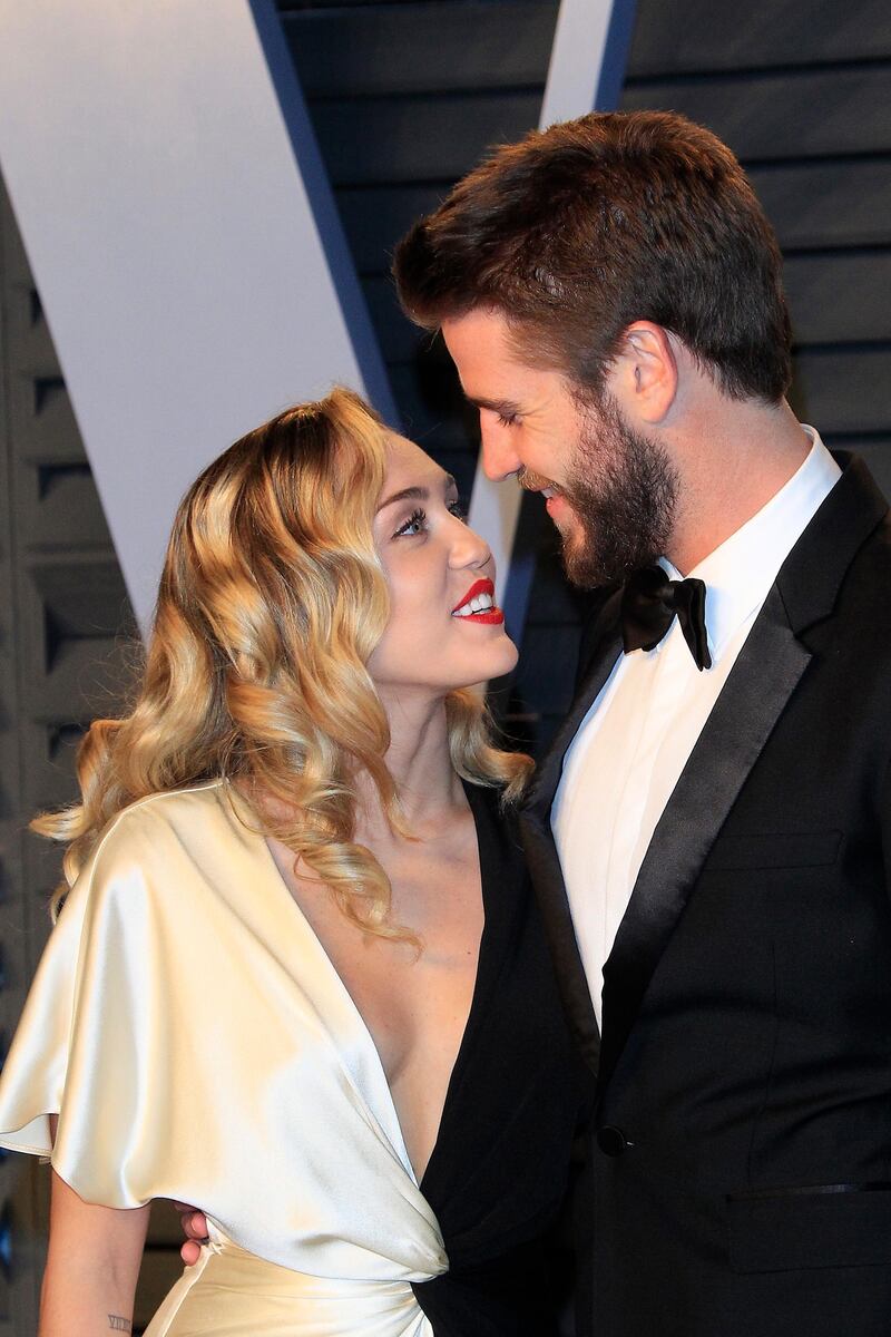 epa07249713 (FILE) - Miley Cyrus (L) and Liam Hemsworth (R) pose at the 2018 Vanity Fair Oscar Party following the 90th annual Academy Awards ceremony in Beverly Hills, California, USA, 04 March 2018 (reissued 26 December 2018). According to reports, Miley Cyrus confirmed on 26 December 2018 that the couple got married which is insinuated through pictures Cyrus shared on social media.  EPA/NINA PROMMER *** Local Caption *** 54176130