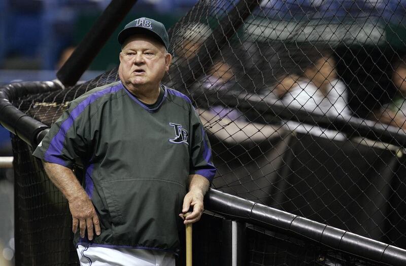 In this Sept. 21, 2007 file photo, Tampa Bay Devil Rays special advisor Don Zimmer leans against the batting cage before a baseball game between the Devil Rays and Boston Red Sox, in St. Petersburg, Fla. Don Zimmer, a popular fixture in professional baseball for 66 years as a manager, player, coach and executive, has died. He was 83. AP Photo/Chris O'Meara
