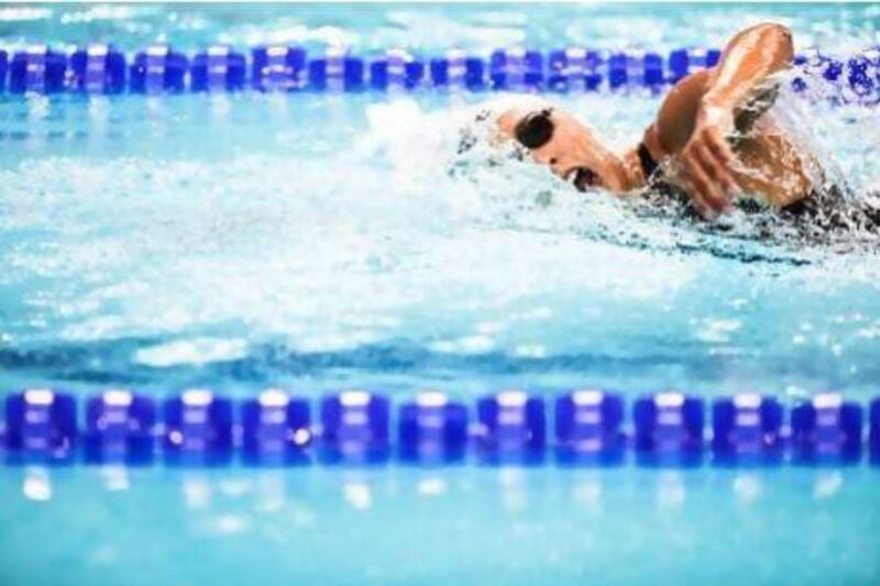 Canada's Olivia Anderson cuts through the water in the 800-metre freestyle event in Dubai. She finished in 13th place. Lee Hoagland / The National