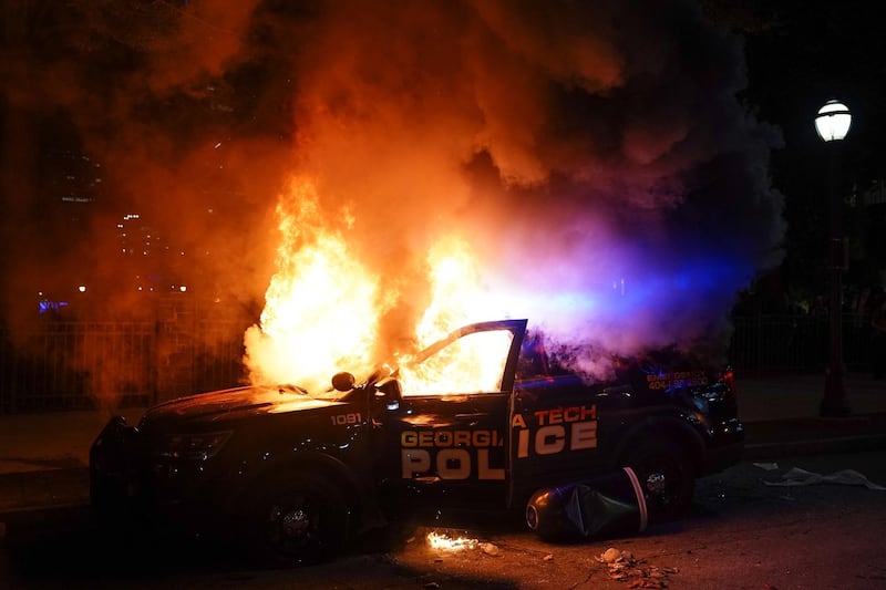 A police car burns during a protest on May 29, 2020 in Atlanta, Georgia. Getty Images/AFP