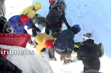 A screen grab from footage broadcast on Iranian state TV Irib on December 26, 2020 shows a rescue operation for mountain climbers hit by avalanches north of Tehran. AFP