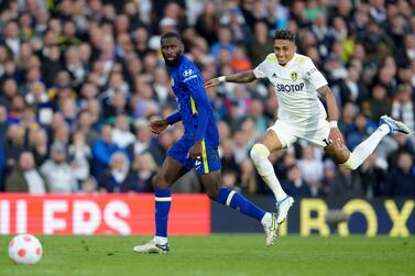 Leeds United's Raphinha, right, challenges Chelsea's Antonio Rudiger during the English Premier League soccer match between Leeds United and Chelsea at Elland Road in Leeds, England, Wednesday May 11, 2022.  (AP Photo / Jon Super)