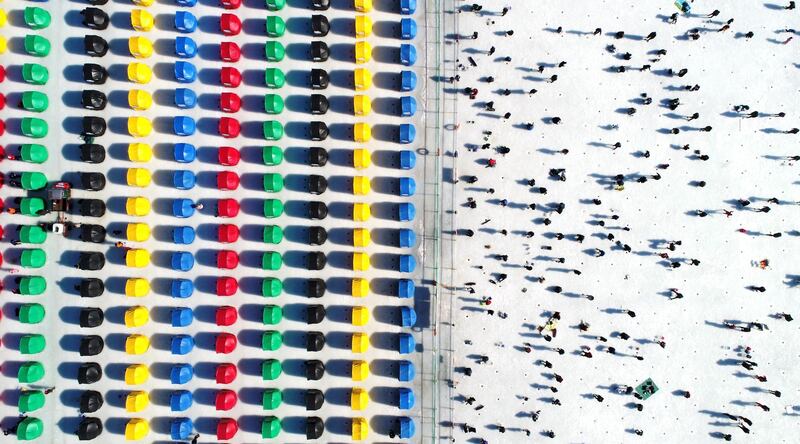 Festival visitors enjoying fishing on a frozen river during the annual Pyeongchang Trout Festival, South Korea. EPA