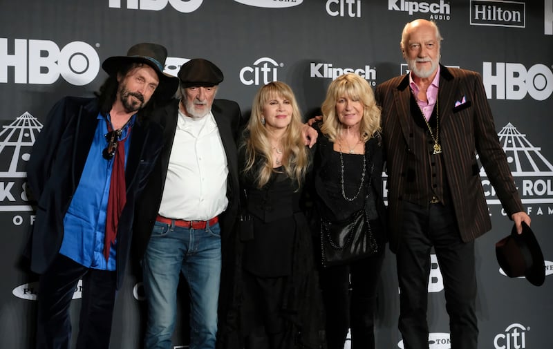 Members of Fleetwood Mac, from left, Mike Campbell, John McVie, Nicks, McVie and Fleetwood at the Rock and Roll Hall of Fame induction in New York, in March 2019.  AP