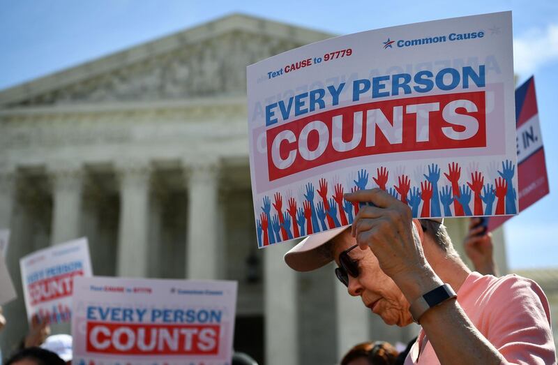 (FILES) In this file photo demonstrators rally at the US Supreme Court in Washington, DC, on April 23, 2019, to protest a proposal to add a citizenship question in the 2020 Census. US President Donald Trump's administration wages its last major policy fight before the Supreme Court on November 30, 2020 as it seeks to exclude undocumented immigrants from the population count used to determine states' representation in Congress. If the outgoing president's plan goes forward, states with large numbers of undocumented immigrants could see their influence reduced in the US House of Representatives.
 / AFP / MANDEL NGAN
