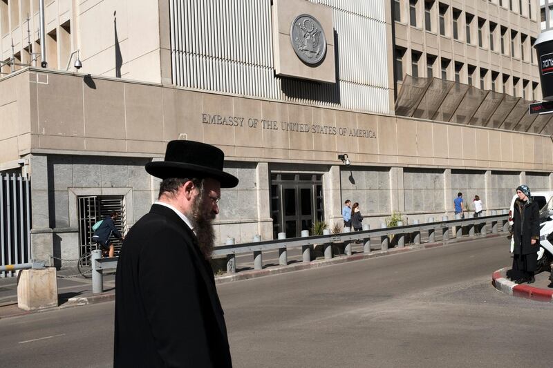 epa06366364 An ultra-Orthodox Jewish man passes by the US Embassy in Tel Aviv, Israel, 04 December 2017. There is speculation in the media that US President Donald Trump will soon announce that Jerusalem should be the recognised as the capital of Israel, amid further speculation that the US Embassy should be moved from Tel Aviv to Jerusalem, fulfilling one of his campaign promises. The Palestinians Authority has said that if the embassy is moved and Jaerusalem is declared the capital of Israel, all peace talks will be called off.  EPA/JIM HOLLANDER