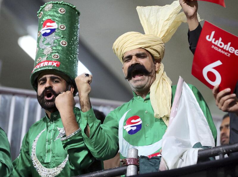 Sharjah, United Arab Emirates - February 21, 2019:  Fans celebrate during the game between Peshawar Zalmi and Karachi Kings in the Pakistan Super League. Thursday the 21st of February 2019 at Sharjah Cricket Stadium, Sharjah. Chris Whiteoak / The National