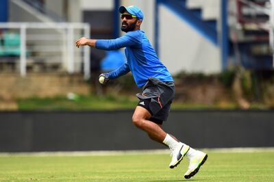 (FILES) This file photo taken on June 22, 2017, shows India's Dinesh Karthik fielding a ball during a practice session at the Queen's Park Oval in Port of Spain, Trinidad, ahead of the first One Day International (ODI) match between West Indies and India. 
Wicketkeeper Dinesh Karthik will replace injured Wriddhiman Saha in India's squad for the third and final Test against South Africa, the country's cricket board said on January 16. / AFP PHOTO / Jewel SAMAD