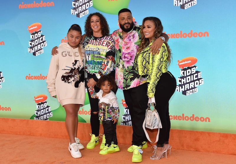 Producer/songwriter DJ Khaled, second right, wife Nicole Tuck, second left, son Asahd Tuck Khaled, and family members. AFP
