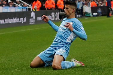 FILE PHOTO: Soccer Football - Premier League - Newcastle United v Manchester City - St James' Park, Newcastle, Britain - December 19, 2021  Manchester City's Joao Cancelo celebrates scoring their second goal Action Images via Reuters/Lee Smith EDITORIAL USE ONLY. No use with unauthorized audio, video, data, fixture lists, club/league logos or 'live' services. Online in-match use limited to 75 images, no video emulation. No use in betting, games or single club /league/player publications.  Please contact your account representative for further details./File Photo