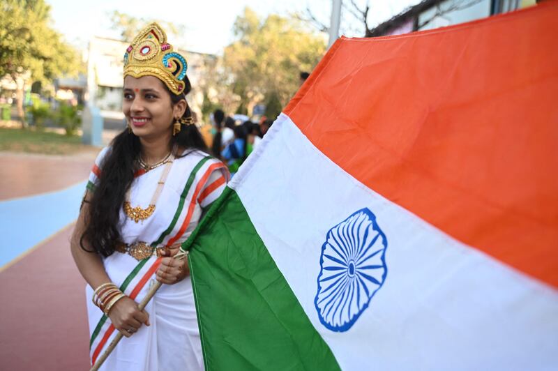A school pupil holds the Indian flag during Republic Day celebrations in Secunderabad. AFP