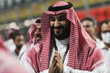 Saudi Crown Prince Mohammed bin Salman Al Saud reacts on the grid before the inaugural 2021 Formula One Grand Prix of Saudi Arabia at the Jeddah Corniche Circuit in Jeddah, Saudi Arabia, 05 December 2021.   EPA / STR