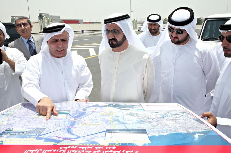 Sheikh Mohammed looks at plans for Al Ittihad Bridge in Dubai. Wam
