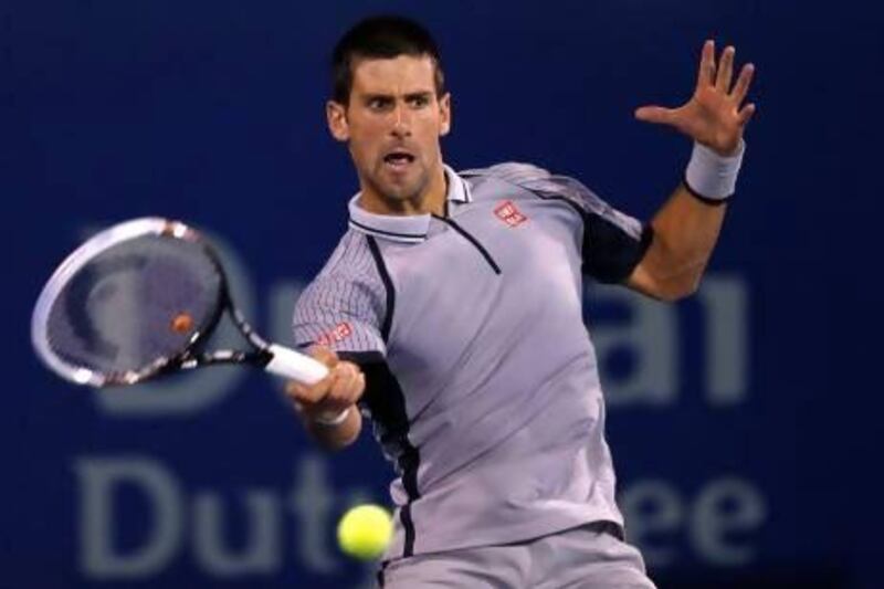 Novak Djokovic returns to Tomas Berdych at the Dubai Tennis Championships.