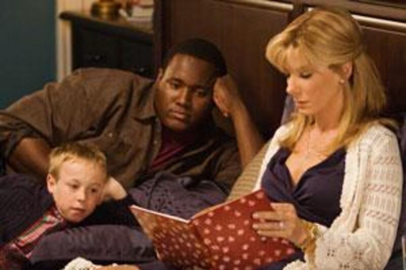 From left, Jae head, Quinton Aaron and Sandra Bullock in a scene from <i>The Blind Side</i>, John Lee Hancock's feel-good dramatisation of actual events.