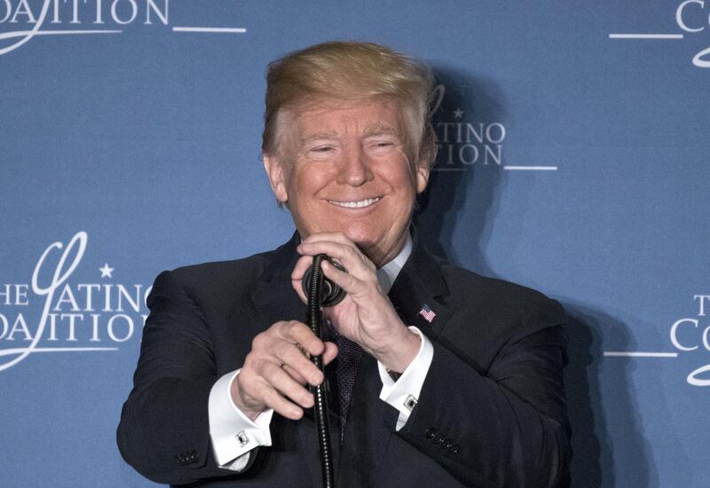 U.S. President Donald Trump smiles while speaking at the Latino Coalition Legislative Summit in Washington, D.C., U.S., on Wednesday, March 7, 2018. Trump praised Hispanic Americans for entrepreneurship and risk-taking and blamed Democrats for lack of progress on immigration reform. Photographer: Ron Sachs/Pool via Bloomberg