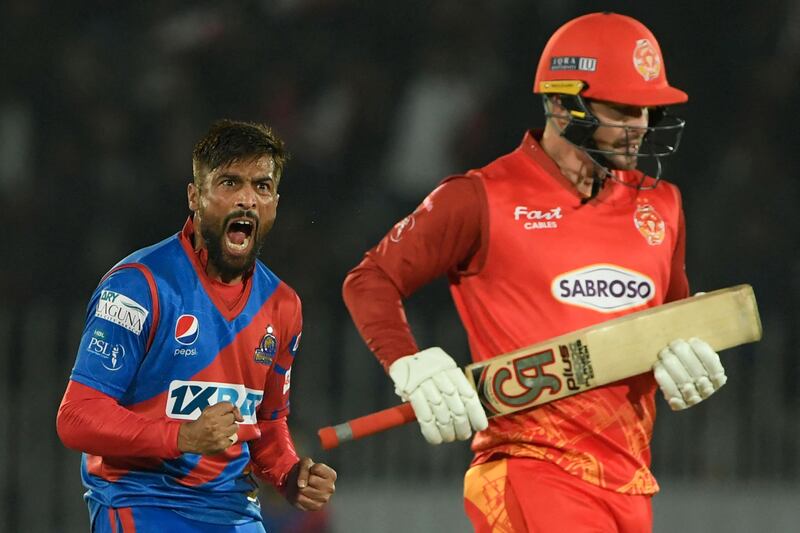 Karachi Kings' Mohammad Amir celebrates after taking the wicket of Islamabad United's Colin Munro during their PSL match. AFP