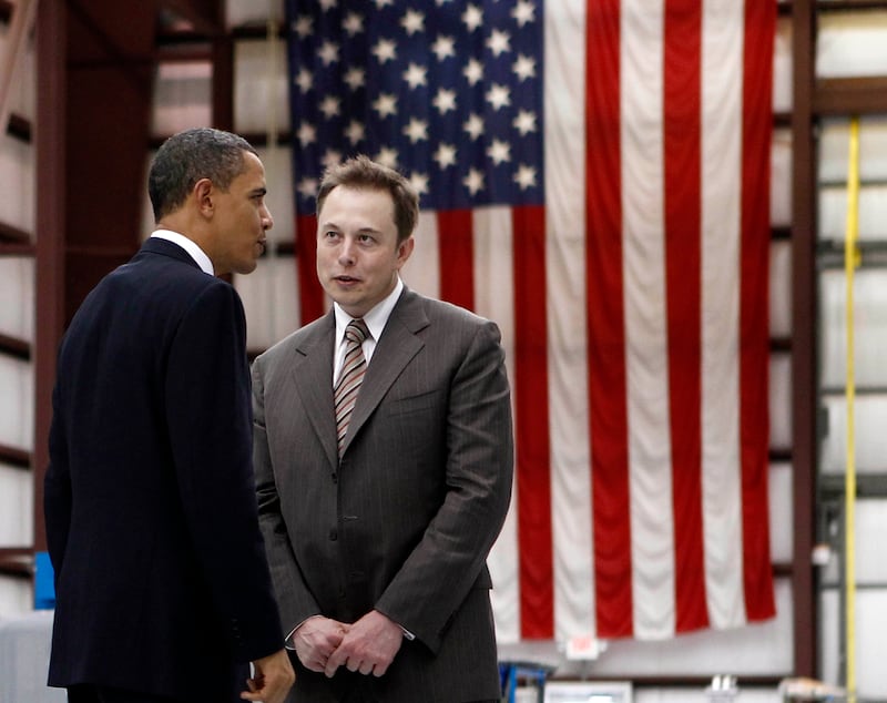 Then US president Barack Obama speaks to Mr Musk on a tour of Cape Canaveral Air Force Station in Cape Canaveral, Florida, in 2010. Reuters