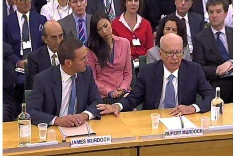 James Murdoch (left) and Rupert Murdoch giving evidence to the Culture, Media and Sport Select Committee in the House of Commons in London on the News of the World phone-hacking scandal.