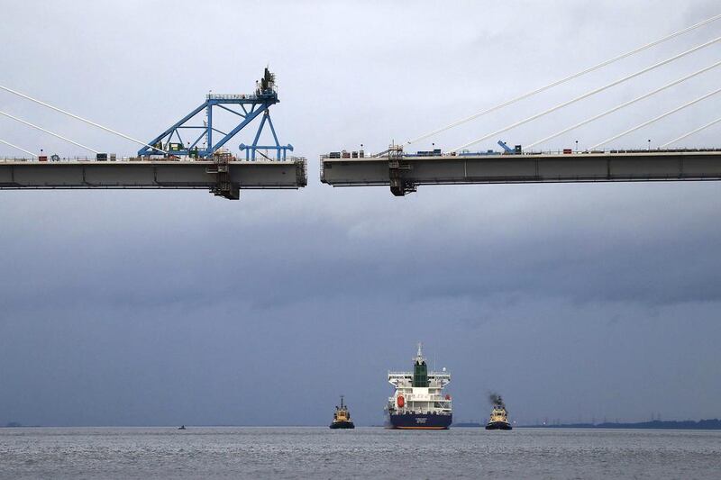 The tanker passes the new crossing under construction as it travels up the Forth to dock at Grangemouth. Russell Cheyne / Reuters