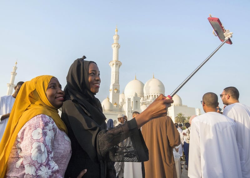 Abu Dhabi, UNITED ARAB EMIRATES - Selfie after performing morning prayers on the first day of Eid-Al Fitr at the Sheikh Zayed Grand Mosque.  Leslie Pableo for The National