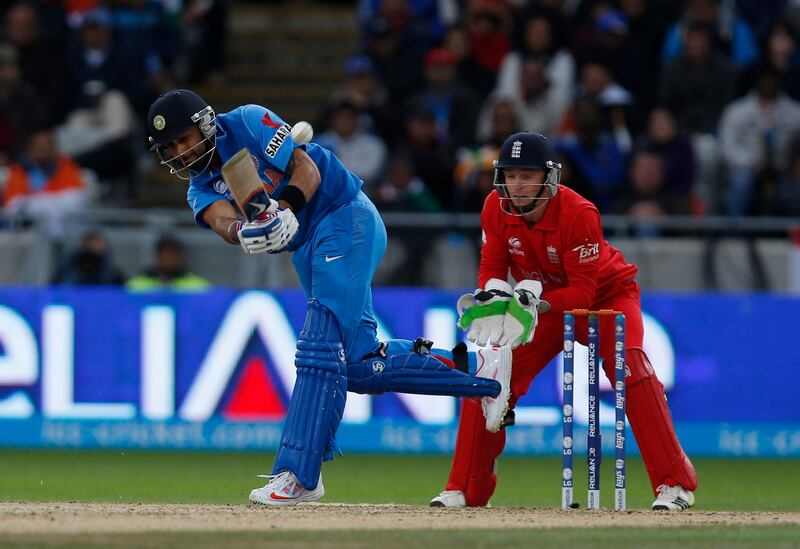 India's Virat Kohli hits a four off the bowling of England's James Tredwell during their ICC Champions Trophy final cricket match at Edgbaston cricket ground in Birmingham, England, Sunday, June 23, 2013. (AP Photo/Sang Tan)  *** Local Caption ***  Britain Cricket ICC Trophy Final England India.JPEG-0b440.jpg