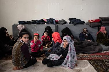 Displaced Syrians sit in the basement of a stadium which has been turned into a makeshift refugee shelter on February 19, 2020 in Idlib, Syria. Getty Images