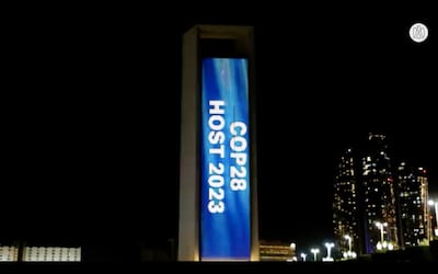 The Adnoc building in Abu Dhabi is lit up to celebrate the Cop28 announcement. Abu Dhabi Media Office