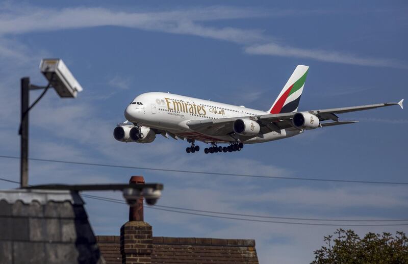 An Airbus SE A380 passenger aircraft, operated by Emirates Airline, passes a CCTV camera as it prepares to land at London Heathrow Airport in London, U.K., on Friday, Sept. 13, 2019. Climate activists were planning to fly toy drones near Heathrow Friday as part of a campaign to draw attention to an expected increase in greenhouse gas emissions from a planned expansion of the airport.  Photographer: Chris Ratcliffe/Bloomberg