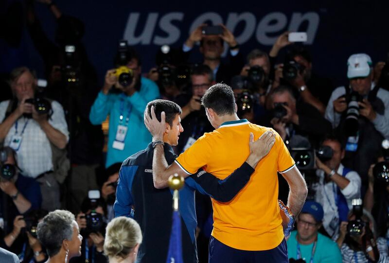 epa07009437 Novak Djokovic of Serbia celebrates with Juan Martin del Potro of Argentina after the men's final on the fourteenth day of the US Open Tennis Championships the USTA National Tennis Center in Flushing Meadows, New York, USA, 09 September 2018. The US Open runs from 27 August through 09 September.  EPA/JASON SZENES *** Local Caption *** 53000073