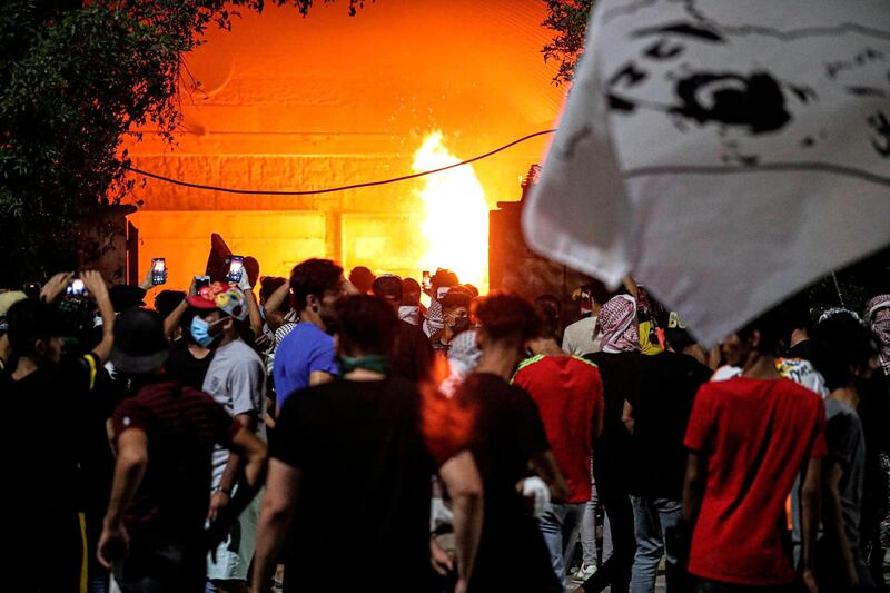 Protesters threw petrol bombs at a parliament building. AP