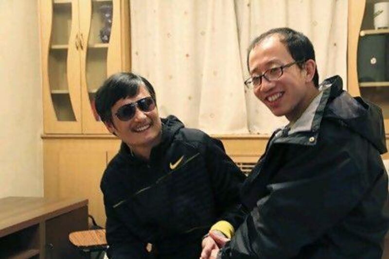 Chen Guangcheng, a blind legal activist, left, with Hu Jia, one of China's most prominent dissidents. Mr Chen is under US protection in Beijing after fleeing from house arrest.