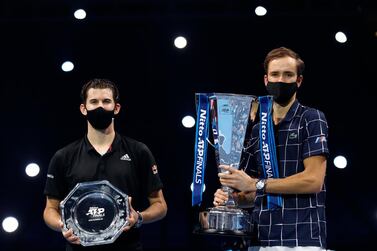 LONDON, ENGLAND - NOVEMBER 22: Daniil Medvedev of Russia poses with the winners trophy and Dominic Thiem of Austria poses with runners up plate after their singles final match during day eight of the Nitto ATP World Tour Finals at The O2 Arena on November 22, 2020 in London, England. (Photo by Clive Brunskill/Getty Images)