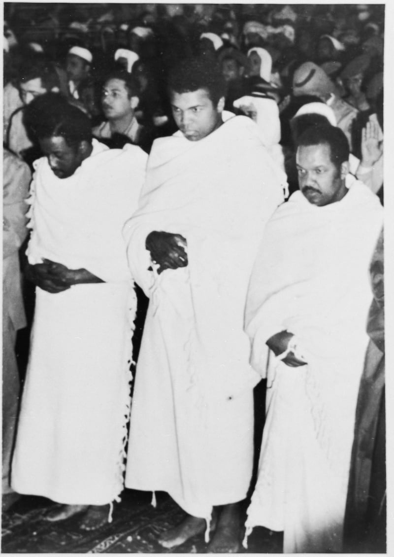 Ali prays inside the Grand Mosque in Makkah. He said that during a visit to the Prophet Mohammed's tomb in Madinah he became convinced that he could defeat Joe Frazier in the ring. Getty