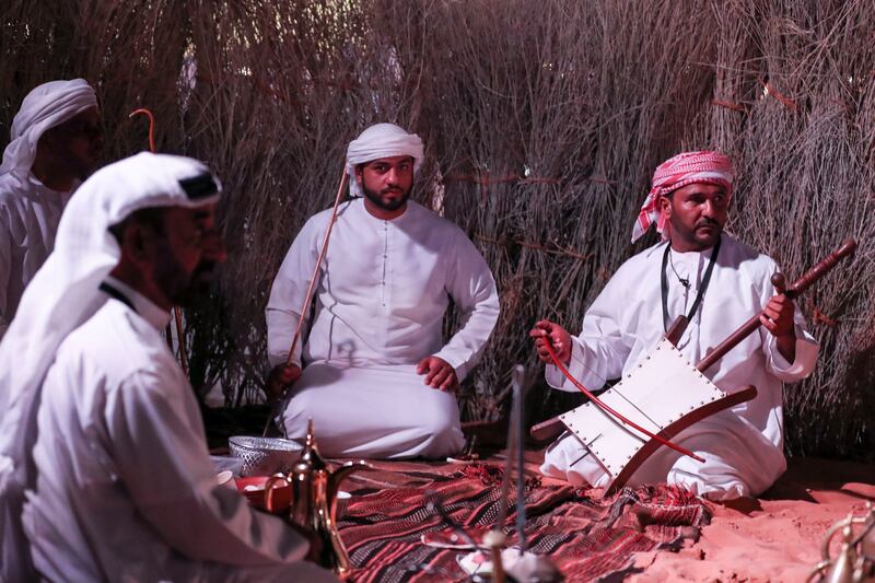 Emirati men depicting the old days of gathering with coffee.