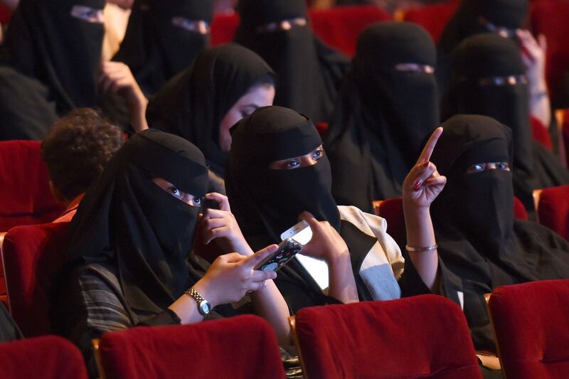 (FILES) This file photo taken on October 20, 2017 shows Saudi women attending the "Short Film Competition 2" festival at King Fahad Culture Center in Riyadh.
Saudi Arabia on Monday announced a lifting of the kingdom's decades-long ban on cinemas, a landmark decision part of a series of social reforms ushered in by the powerful crown prince.
 / AFP PHOTO / FAYEZ NURELDINE
