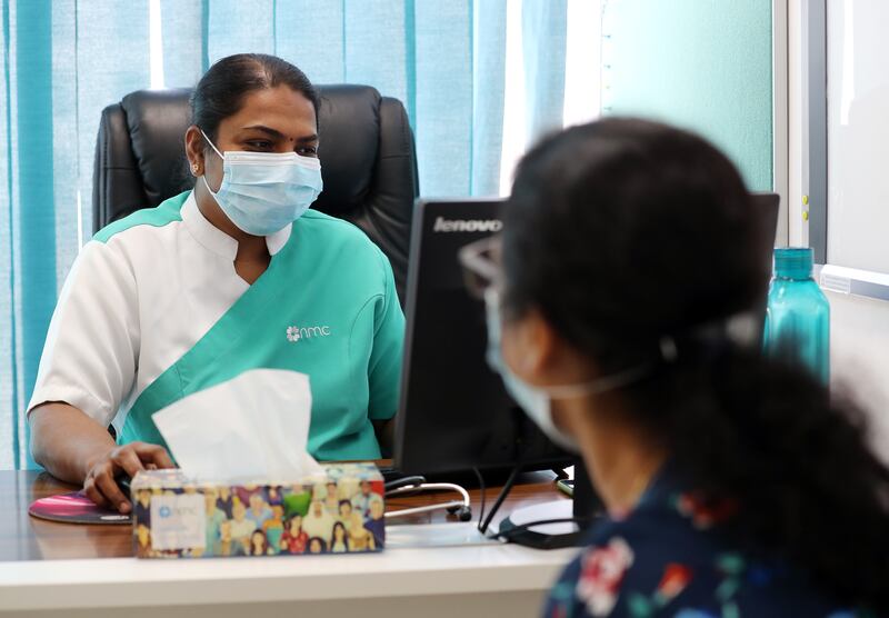 Fiji Antony has a consultation with head nurse Ahalya Chandrashekar before her Pfizer Covid-19 vaccine at the NMC Royal Hospital DIP in Dubai.