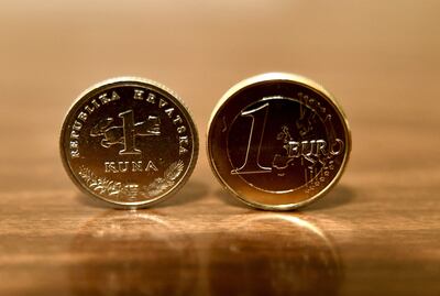 One kuna and one euro coins. AFP