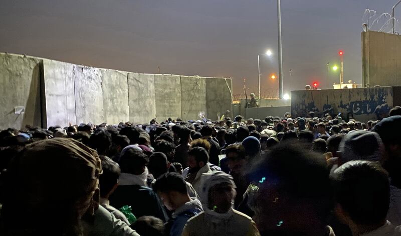 A crowd waits to enter Kabul airport as thousands try to flee the city following the Taliban takeover. EPA