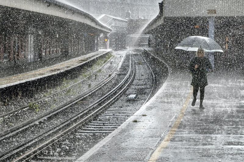 'Just Walking in the Rain', Adrian Campfield: 'My wife and I were standing on the platform waiting for the train at Waterloo Station in London, England. We had been walking around London for the day taking photos and were on the way home. Without any warning the heavens opened and the storm broke thunder and lightning everywhere. We both ran for cover under the platform shelter as did all the other waiting passengers. I saw this lone woman walking towards me with the umbrella up and I had enough time to get the camera ready. I zoomed in a little, set the speed at 1000/iso to freeze the falling raindrops and this was the result.'