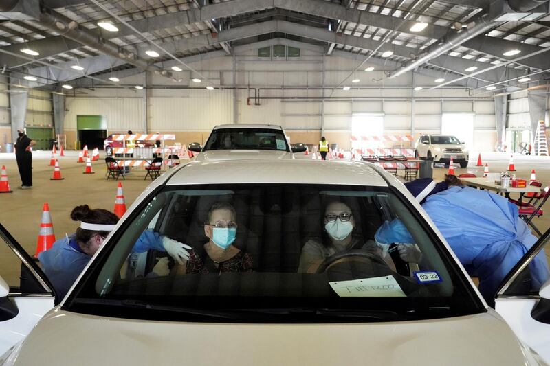 People receive vaccinations at a drive-through site in Robstown, Texas, US. Reuters