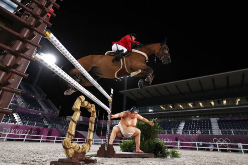 Jessica Springsteen of US, riding Don Juan Van De Donkhoeve, competes during the jumping individual qualifier.