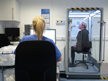A Long Covid patient takes a pulmonary function test at Hufeland Clinic's Centre for Pneumology. Getty Images