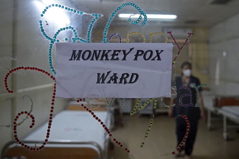 A health worker walks inside an isolation ward built as a precautionary measure for monkeypox patients at a civil hospital in Ahmedabad, India. on July 25. AFP