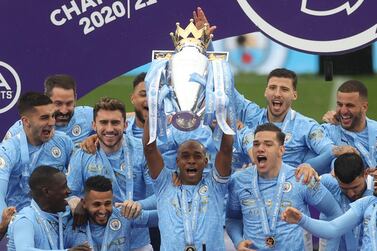 Soccer Football - Premier League - Manchester City v Everton - Etihad Stadium, Manchester, Britain - May 23, 2021 Manchester City's Fernandinho lifts the trophy as they celebrates winning the Premier League Pool via REUTERS/Carl Recine EDITORIAL USE ONLY. No use with unauthorized audio, video, data, fixture lists, club/league logos or 'live' services. Online in-match use limited to 75 images, no video emulation. No use in betting, games or single club /league/player publications. Please contact your account representative for further details.