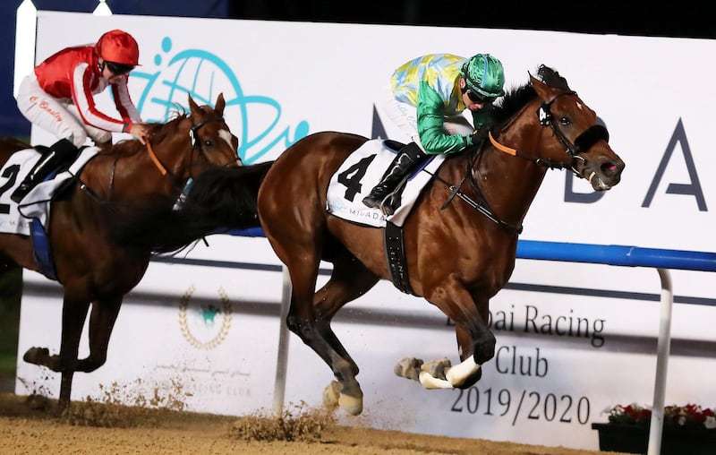 DUBAI , UNITED ARAB EMIRATES , Dec 19  – 2019 :- Tadhg O’Shea (no 4) guides Secret Ambition (GB)  to win the 5th horse race, Dubai Creek Mile, 1600m dirt at the Meydan Racecourse in Dubai. ( Pawan Singh / The National ) For Sports. Story by Amith