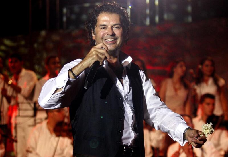 The Lebanese singer Ragheb Alama, who plays in Abu Dhabi tomorrow, is also a judge on the TV show Arab Idol and a UN climate change ambassador. AFP / Fethi Belaid