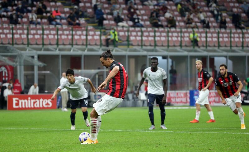 Zlatan Ibrahimovic scores from the penalty spot to give AC Mlan a 2-0 lead against Bologna. EPA