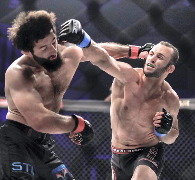 Abu Dhabi, United Arab Emirates, October 4, 2019.   --  Brave Combat Federation 27 at the Mubadala Arena.
Welterweight:
(L-R) Abdoul Abdouraguimov (FRA) gets punched on the temple by Jarrah Al Selawe (JOR) during the main event.
Victor Besa / The National
Section:  SP
Reporter:  Amith Passela