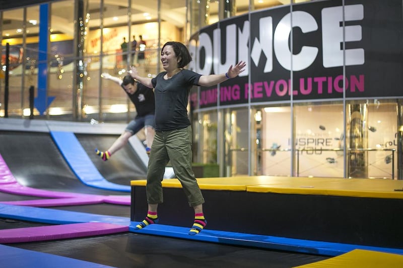 Visitors jump on trampolines at Bounce Abu Dhabi which opened in Marina Mall on Tuesday. Mona Al Marzooqi / The National